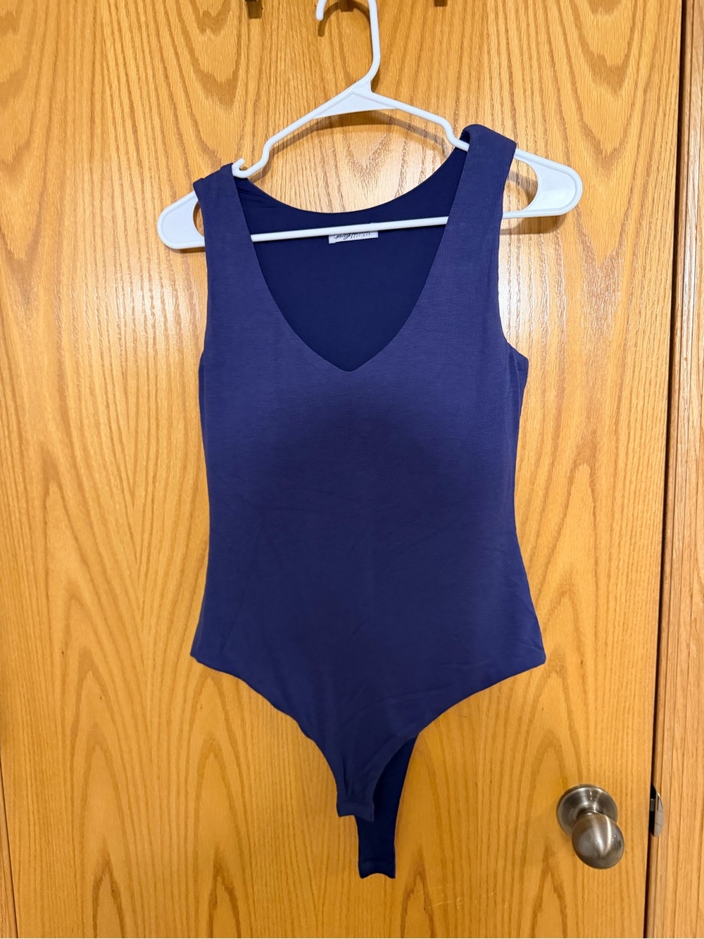 Magnolia Navy Sleeveless V‑Neck Bodysuit